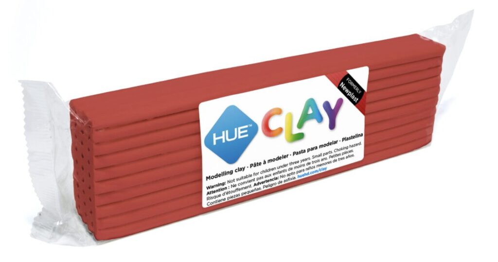 A bar of red HUE Clay marked with the HUE branding and conformity information